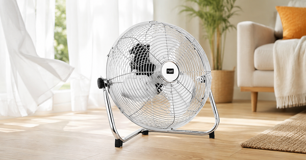 Nyxi branded metal floor fan with chrome grill in a bright summer living room