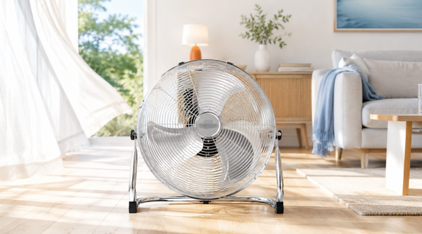 Nyxi metal floor fan with chrome grill in a bright summer living room